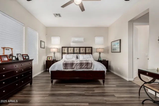 a bedroom with a bed and a dresser