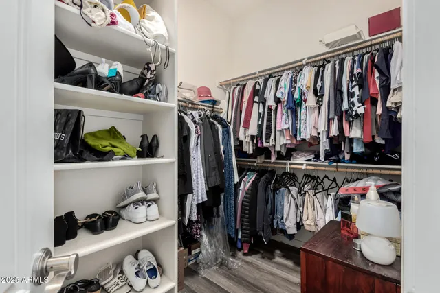 a bedroom with bed couch and window