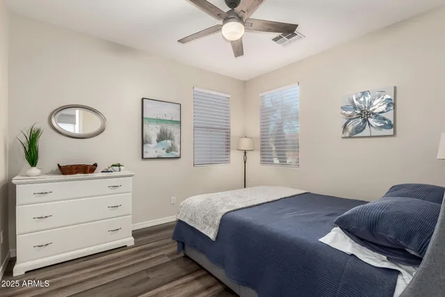 a view of a patio with a dining table and chairs with wooden floor