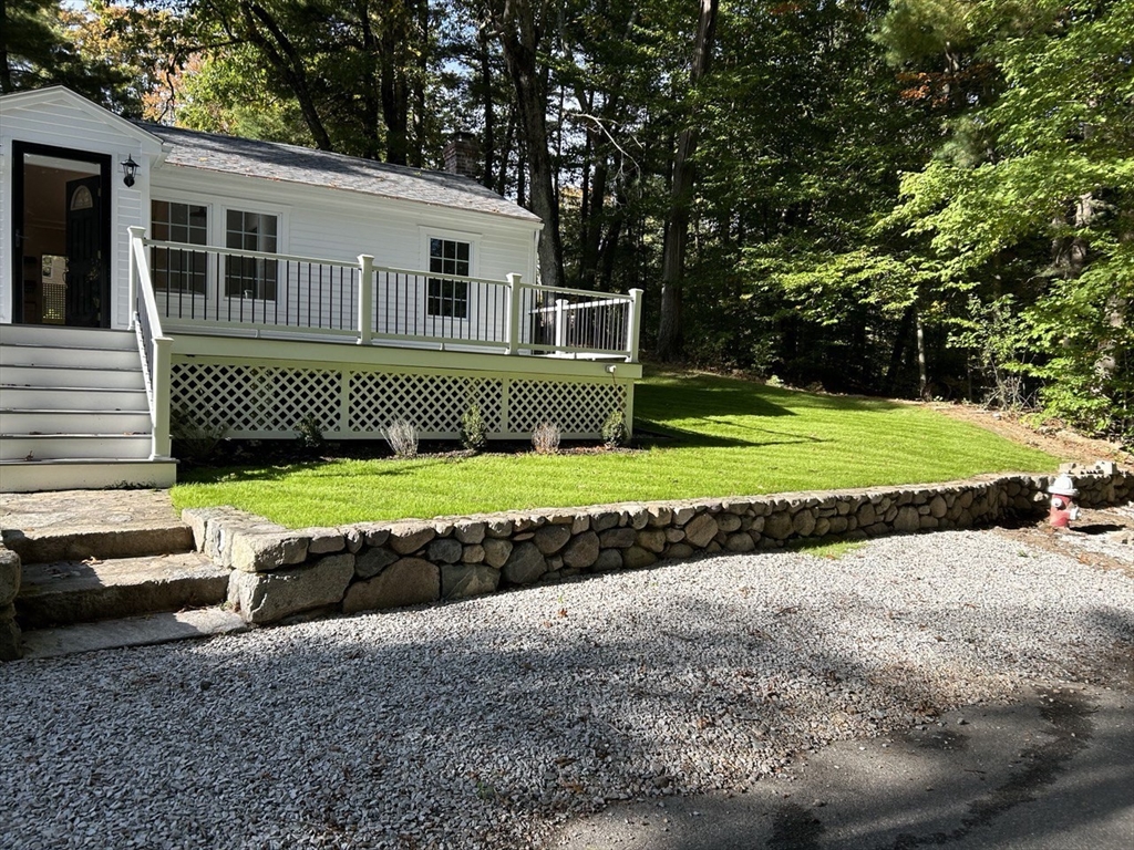 13 Donna Road Holbrook, MA 02343 - Photo 3 of 31 a front view of a house with a yard and garage