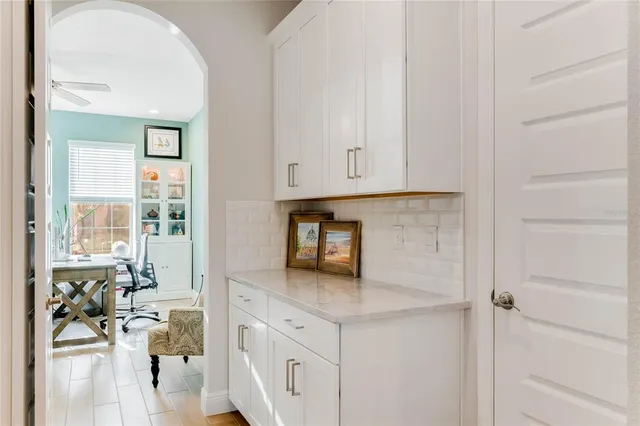 a kitchen with stainless steel appliances granite countertop a refrigerator and a stove