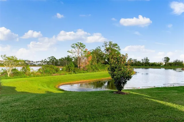 a view of a golf course with a lake