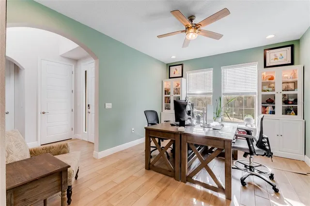 a workspace with furniture window and wooden floor