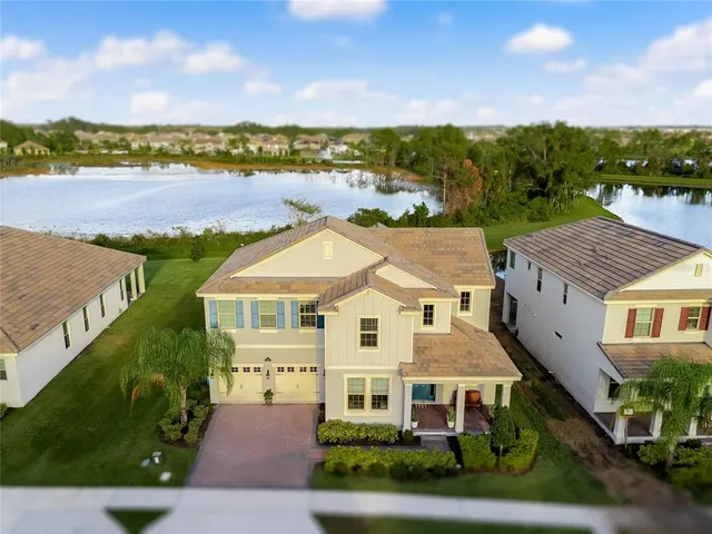 a view of a white house with a ocean view