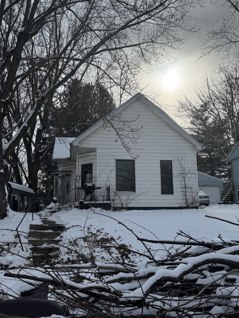 916 West Front Street Bloomington, IL 61701 - Photo 1 of 15 a backyard of a house with yard fire pit and outdoor seating