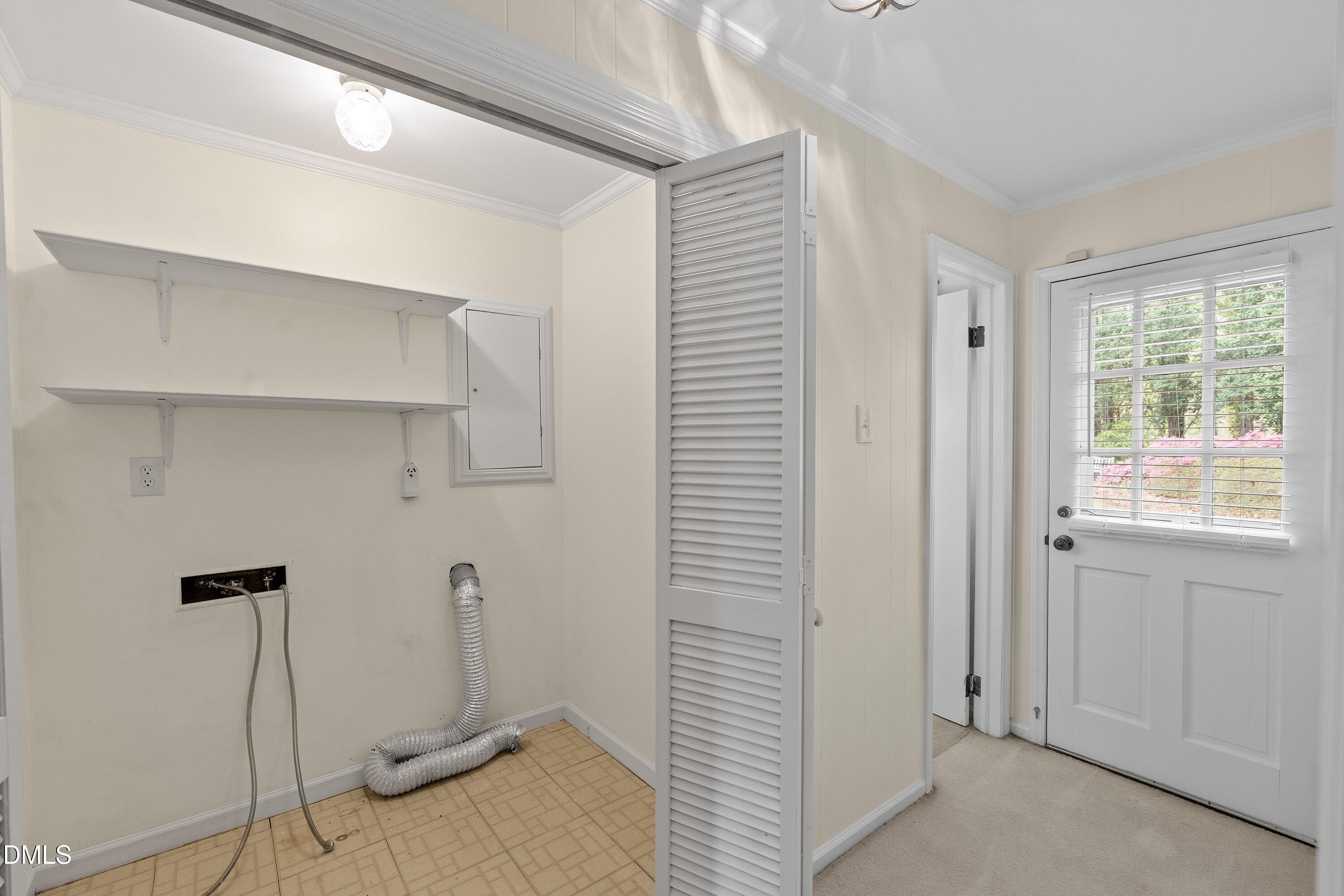 1429 Falls Church Road Raleigh, NC 27609 - Photo 19 of 60 a view of a room with rack on the wall