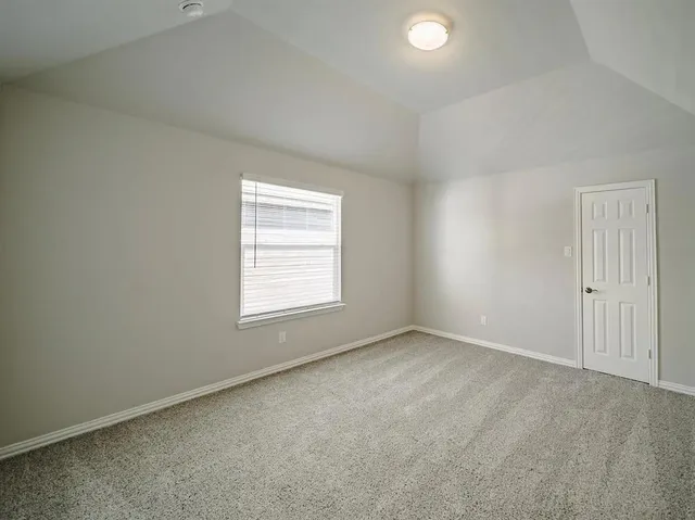an aerial view of a swimming pool with outdoor seating