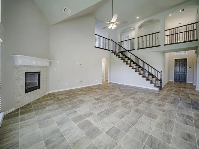 a view of an empty room with a fireplace