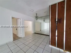 an empty room with a elevator