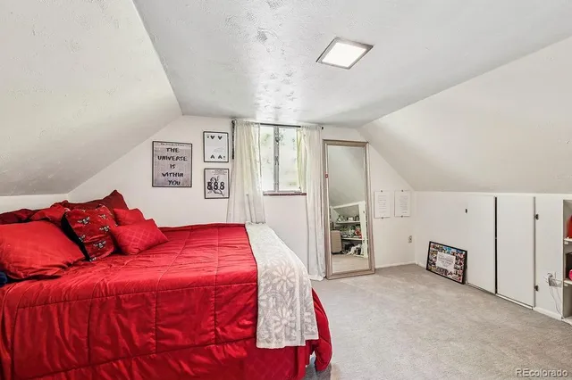 a bedroom with a large bed and a closet