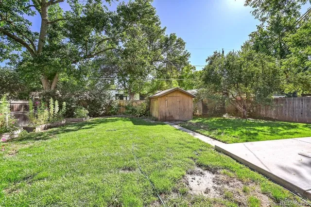 a backyard of a house with lots of green space