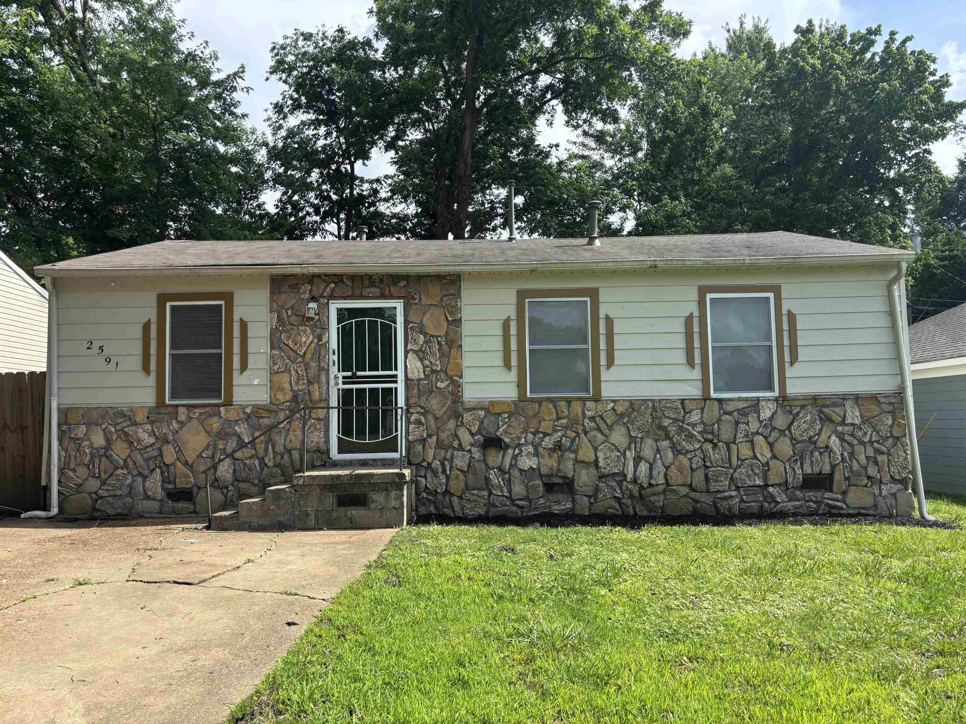 2591 Callie Road Memphis, TN 38127 - Photo 1 of 13 Single-story residence featuring a stone facade and horizontal siding