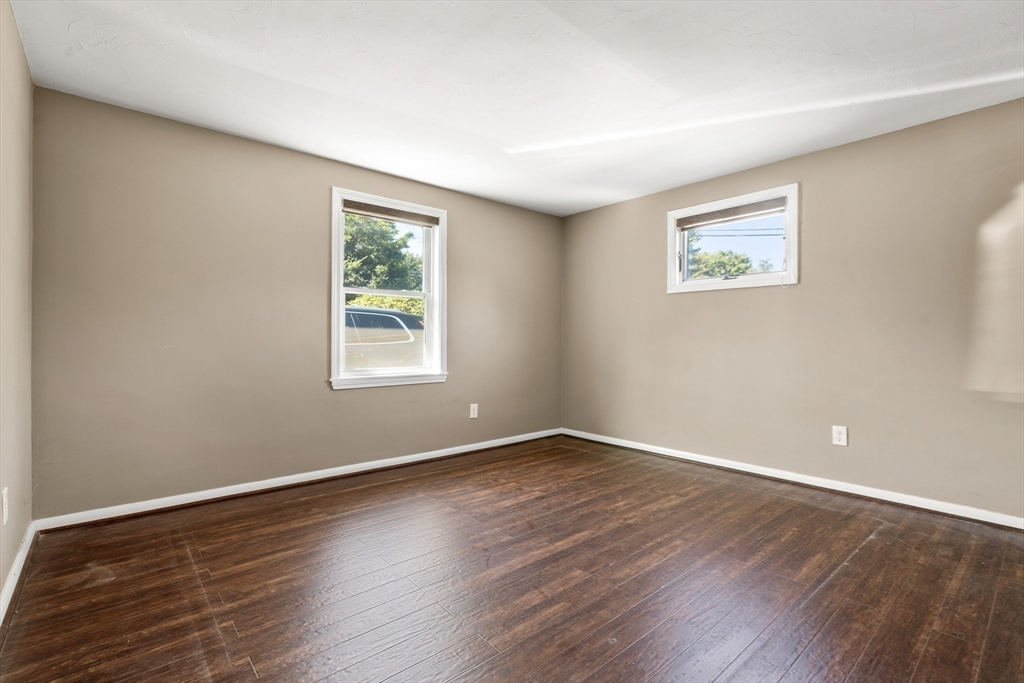 40 Randolph Street Canton, MA 02021 - Photo 14 of 35 a view of an empty room with wooden floor and a window