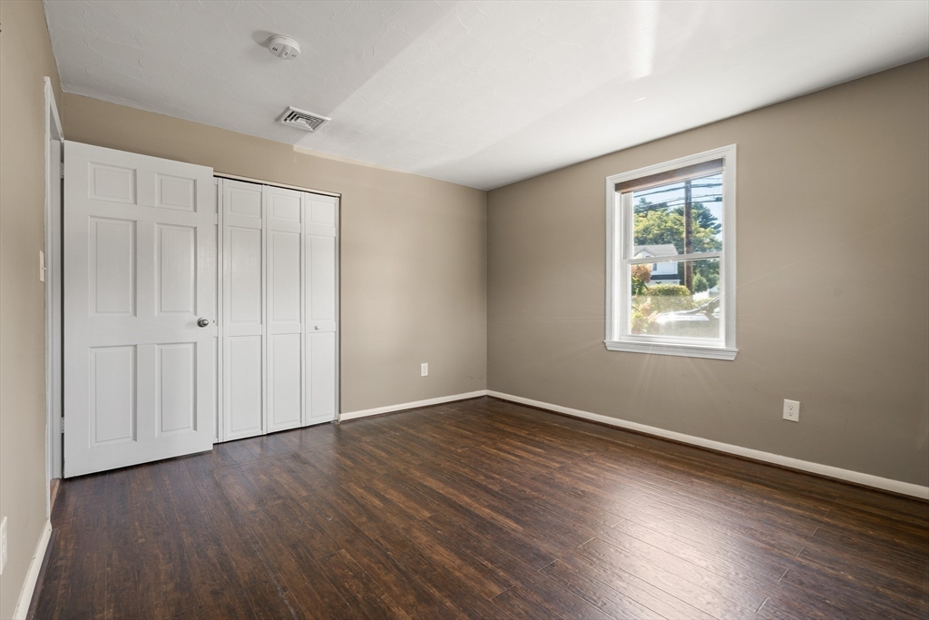 40 Randolph Street Canton, MA 02021 - Photo 15 of 35 a view of an empty room with wooden floor and a window
