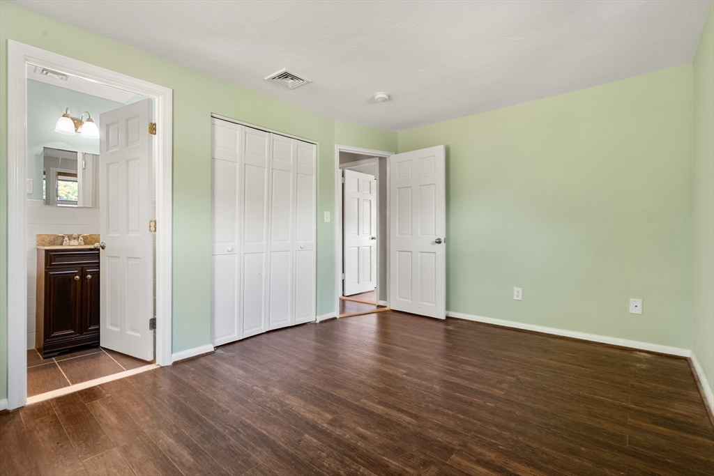 40 Randolph Street Canton, MA 02021 - Photo 18 of 35 an empty room with wooden floor and windows