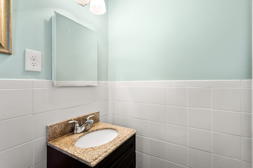 40 Randolph Street Canton, MA 02021 - Photo 19 of 35 a bathroom with a sink and a mirror