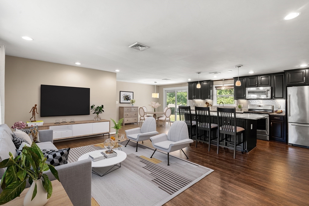 40 Randolph Street Canton, MA 02021 - Photo 2 of 35 a living room with furniture and a flat screen tv