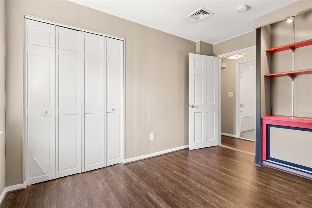 40 Randolph Street Canton, MA 02021 - Photo 21 of 35 a view of an empty room with wooden floor and a window