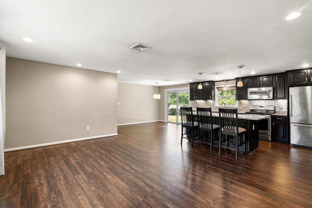 40 Randolph Street Canton, MA 02021 - Photo 3 of 35 a view of a kitchen with dining room and wooden floor