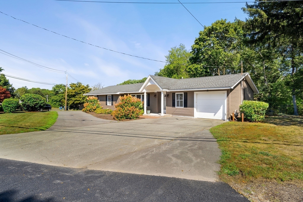 40 Randolph Street Canton, MA 02021 - Photo 32 of 35 a front view of a house with a yard and garage