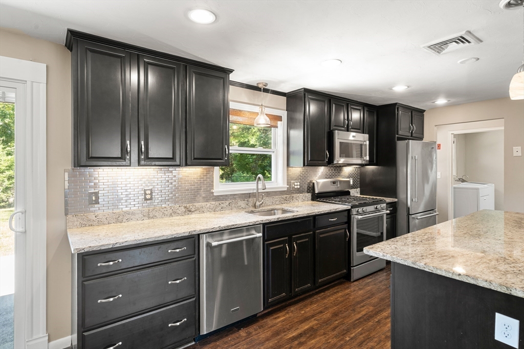 40 Randolph Street Canton, MA 02021 - Photo 5 of 35 a kitchen with stainless steel appliances granite countertop refrigerator sink and cabinets