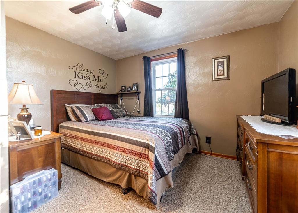 319 Moran Road Butler, PA 16002 - Photo 11 of 24 a bedroom with a bed and a tv