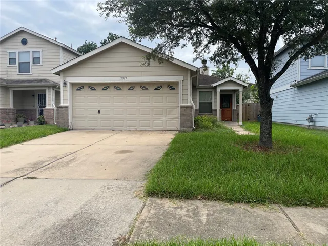 a view of a yard in front view of a house
