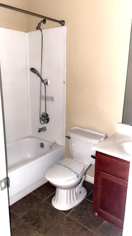 a bathroom with a sink a toilet and a bathtub