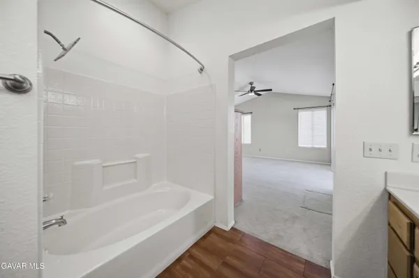 a bathroom with a bathtub and a shower