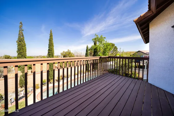 a view of balcony with wooden floor