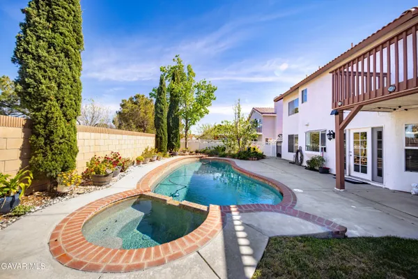 a view of a swimming pool with a patio