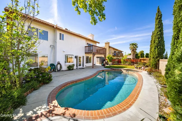 a view of a swimming pool with a lounge chairs