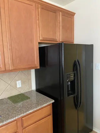 a bathroom with a double vanity sink toilet and shower