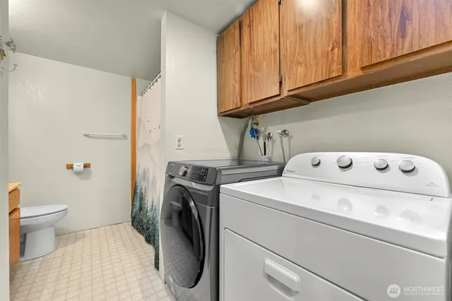 a utility room with dryer and washer