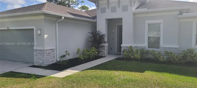 front view of a house with a yard