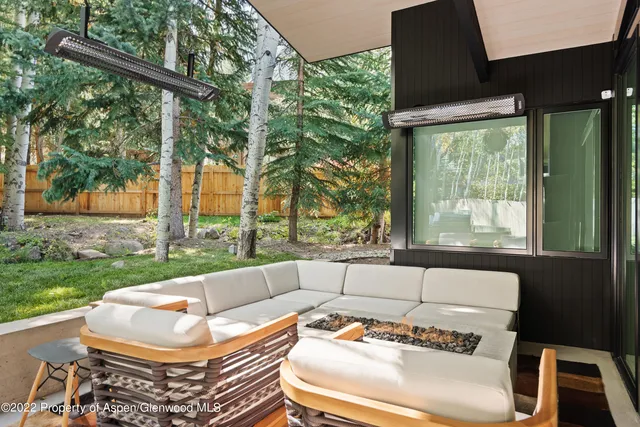 a view of a patio with a yard