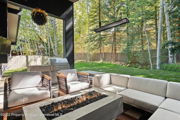 a view of a patio with couches chairs and a table and chairs