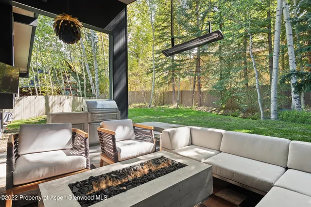 a view of a patio with couches chairs and a table and chairs