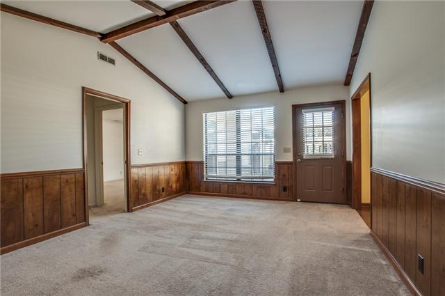 DEN SPACE RIGHT OFF OF THE KITCHEN W/ VAULTED CEILING, EXPOSED BEAMS, AND VIEWS OF THE PRIVATE PATIO