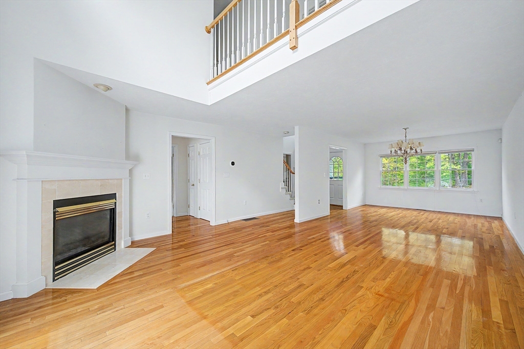 3 Oak View Terrace, Unit 3 Franklin, MA 02038 - Photo 4 of 38 a view of an empty room with a fireplace and a window