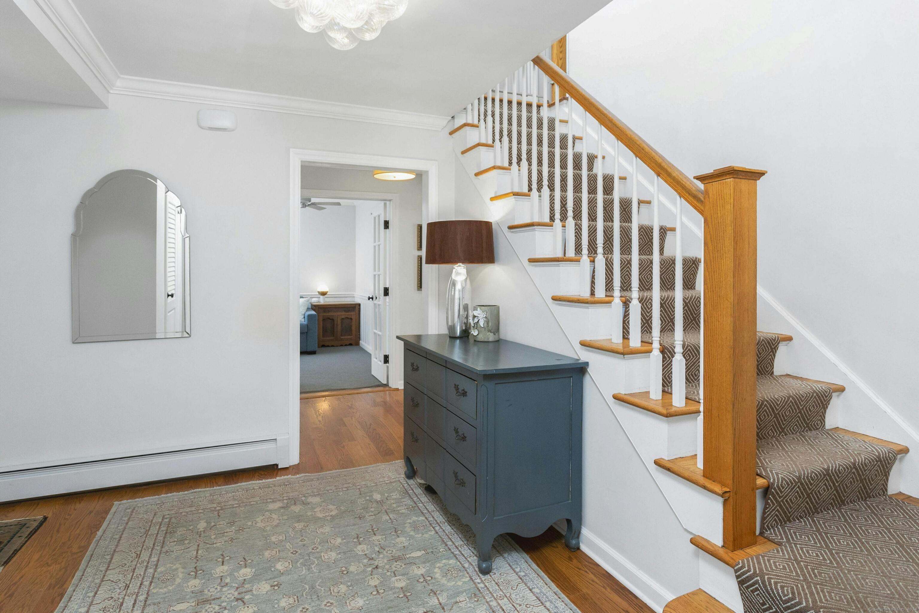 21 Roxbury Lane Wilton, CT 06897 - Photo 19 of 37 The front foyer welcomes visitors with style.