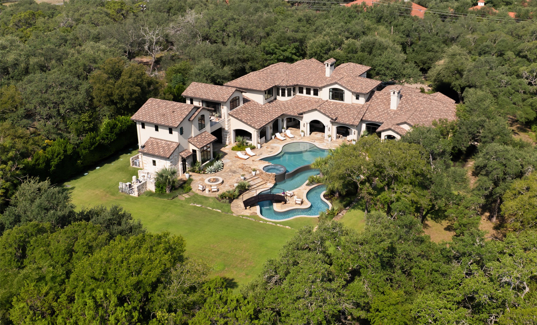 3667 Stoneridge Road Austin, TX 78746 - Photo 36 of 40 The main residence sits intentionally on one side of the property, preserving open space and future flexibility (sports courts, additional structures or gardens).