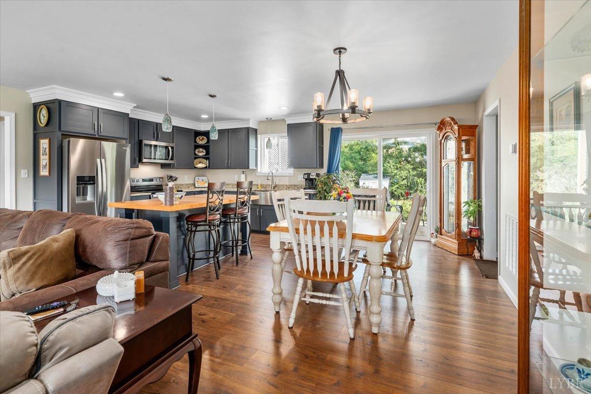 854 Kenmore Road Amherst, VA 24521 - Photo 12 of 37 a view of a dining room with furniture window and wooden floor