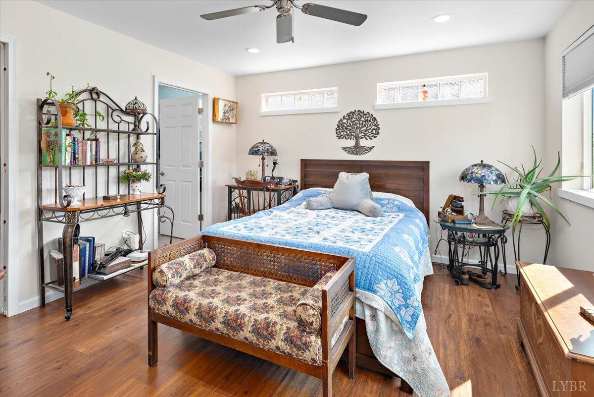 854 Kenmore Road Amherst, VA 24521 - Photo 14 of 37 a bedroom with a bed and a chandelier