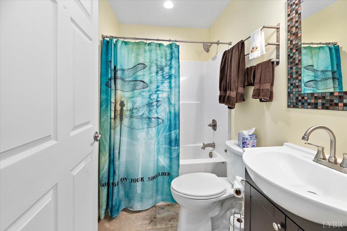 854 Kenmore Road Amherst, VA 24521 - Photo 21 of 37 a bathroom with a sink toilet and shower