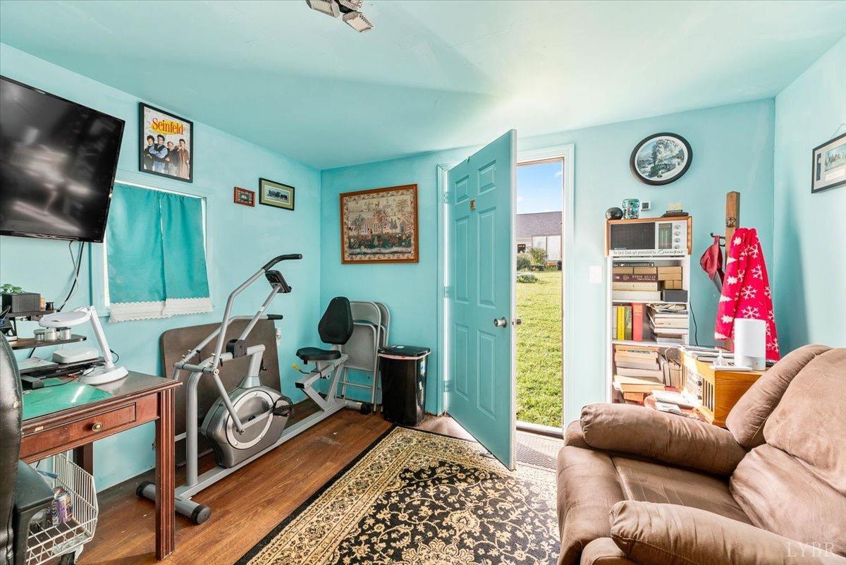 854 Kenmore Road Amherst, VA 24521 - Photo 30 of 37 a bedroom with furniture and a flat screen tv