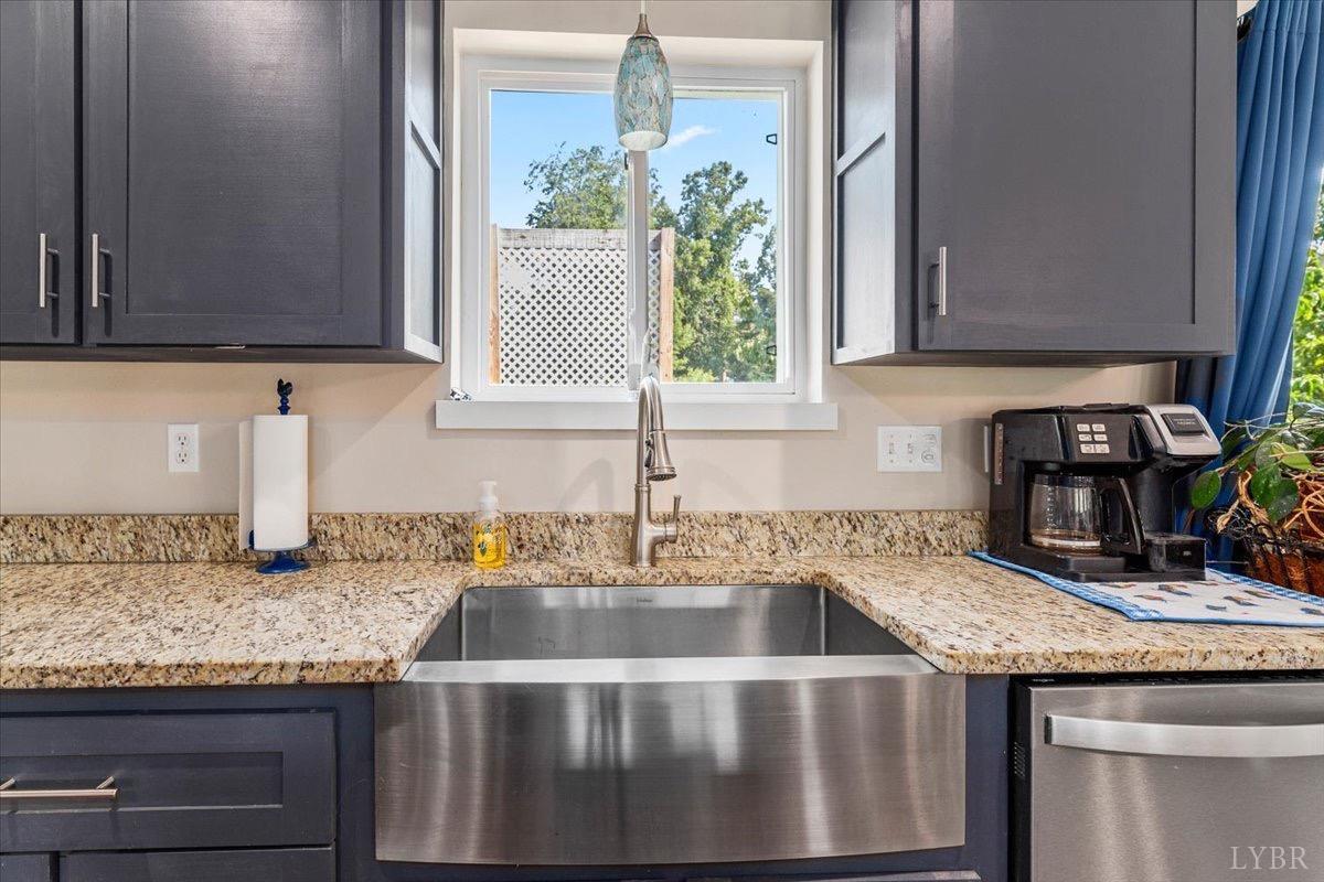 854 Kenmore Road Amherst, VA 24521 - Photo 6 of 37 a kitchen with granite countertop a sink and a stove