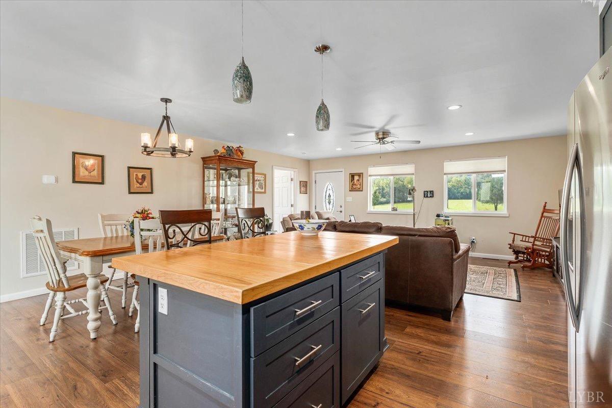 854 Kenmore Road Amherst, VA 24521 - Photo 8 of 37 a kitchen with a stove and chairs