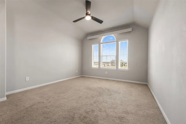 an empty room with a empty space and a window