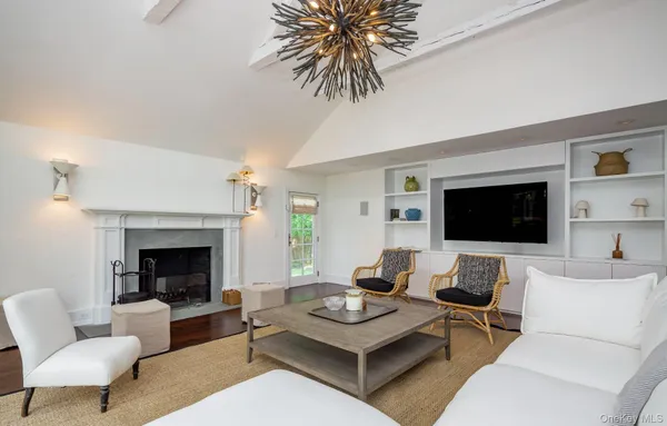 a bedroom with a bed and a television